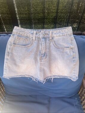 Light Wash Denim Mini Skirt with Raw Hem